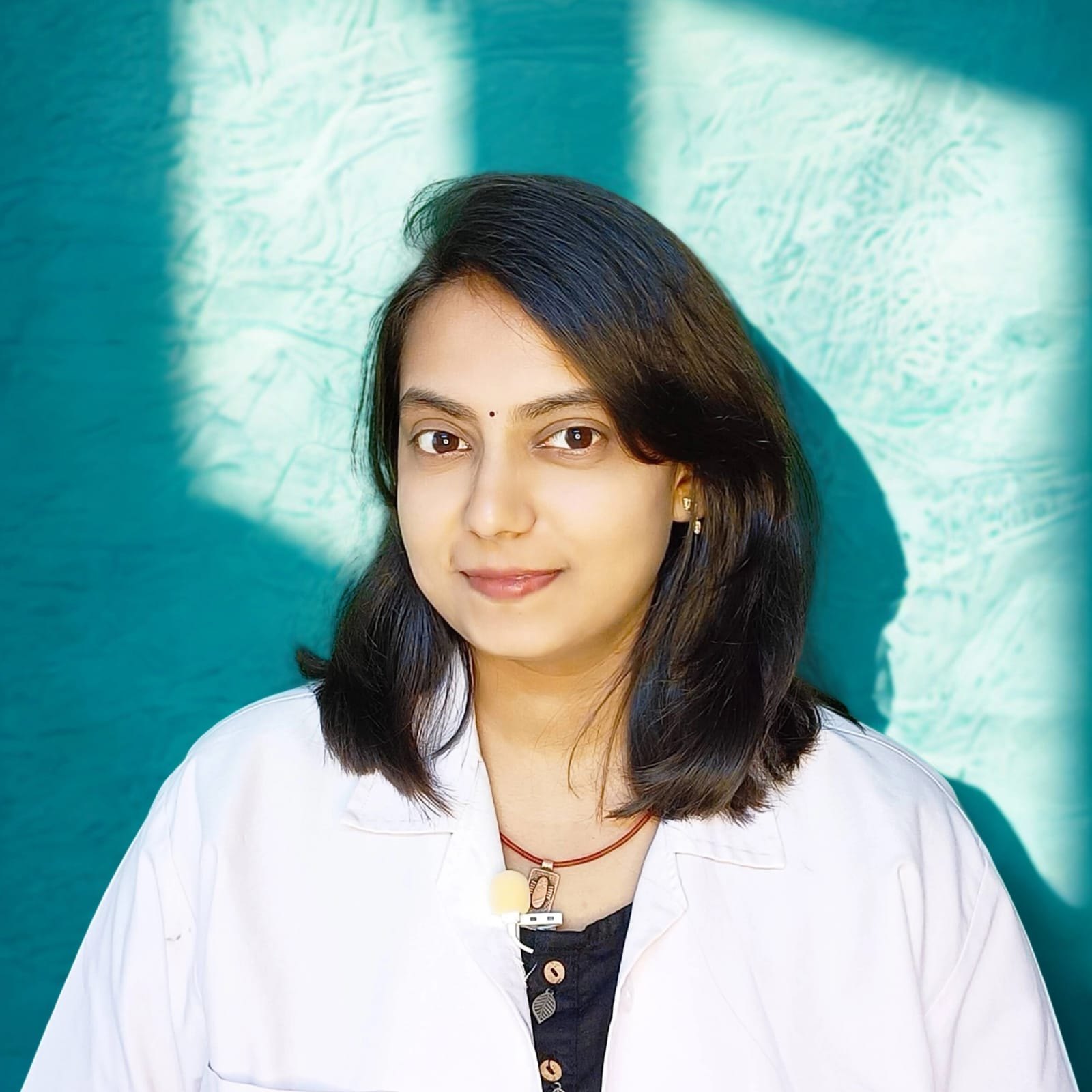 Dr. Namrata Gavali, Ayurvedic physician, in her clinic coat